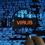 photo of computer code with the word "virus" imposed